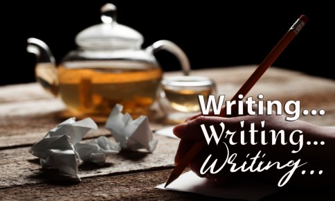 woman writing on sheet of paper with green tea on the background